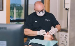 Higson Dental, Grande Prairie Alberta - qualified Dentist and Patient having dental exam